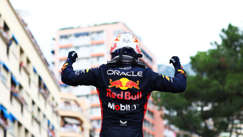 Max Verstappen exits the car in triumphant fashion after the 2023 Monaco Grand Prix.