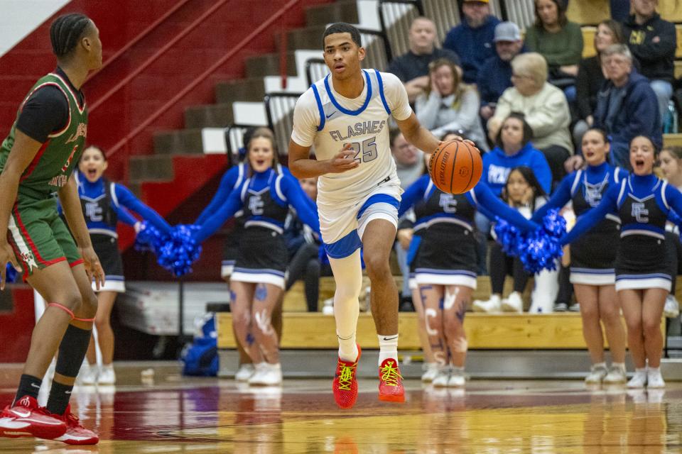 Franklin Central High School sophomore Edward Hazelett III (25) brings the ball up court during the first half of a Boysâ€™ Marion County Basketball Tournament championship game against Lawrence North High School, Saturday, Jan. 13, 2024, at Southport High School.