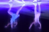 <p>Reflections of performers are seen on the ice during the figure skating gala event during the Pyeongchang 2018 Winter Olympic Games at the Gangneung Oval in Gangneung on February 25, 2018. / AFP PHOTO / Mladen ANTONOV (Photo credit should read MLADEN ANTONOV/AFP/Getty Images) </p>