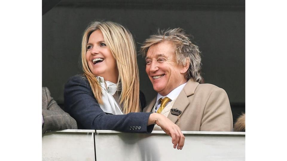 Rod Stewart and Penny Lancaster smiling at races