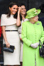 <p>Meghan wore a custom oat-coloured Givenchy dress with a cape for her joint engagement with the Queen in Chester in June 2018. According to Elle, it’s believed to have cost £13,704 [Photo: Getty] </p>