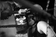 <p>Sgt. Chris Vincenti, right, from the 60th Precinct in Brooklyn, feels the pain in his corner during a grudge match against Ruben Duque at the Brooklyn Smoker in the parking lot of Gargiulo’s Italian restaurant in Coney Island, Brooklyn, on Aug. 24, 2017. (Photo: Gordon Donovan/Yahoo News) </p>