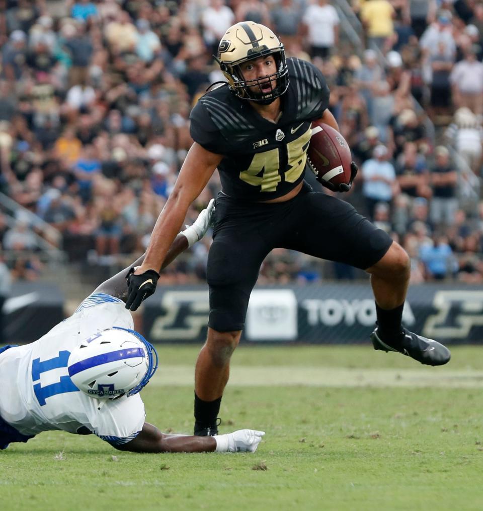 Purdue Boilermakers running back Devin Mockobee (45) stiff arms Indiana State Sycamores linebacker Jarin Johnson (11) during the NCAA football game, Saturday, Sept. 10, 2022, at Ross-Ade Stadium in West Lafayette, Ind. Purdue won 56-0.