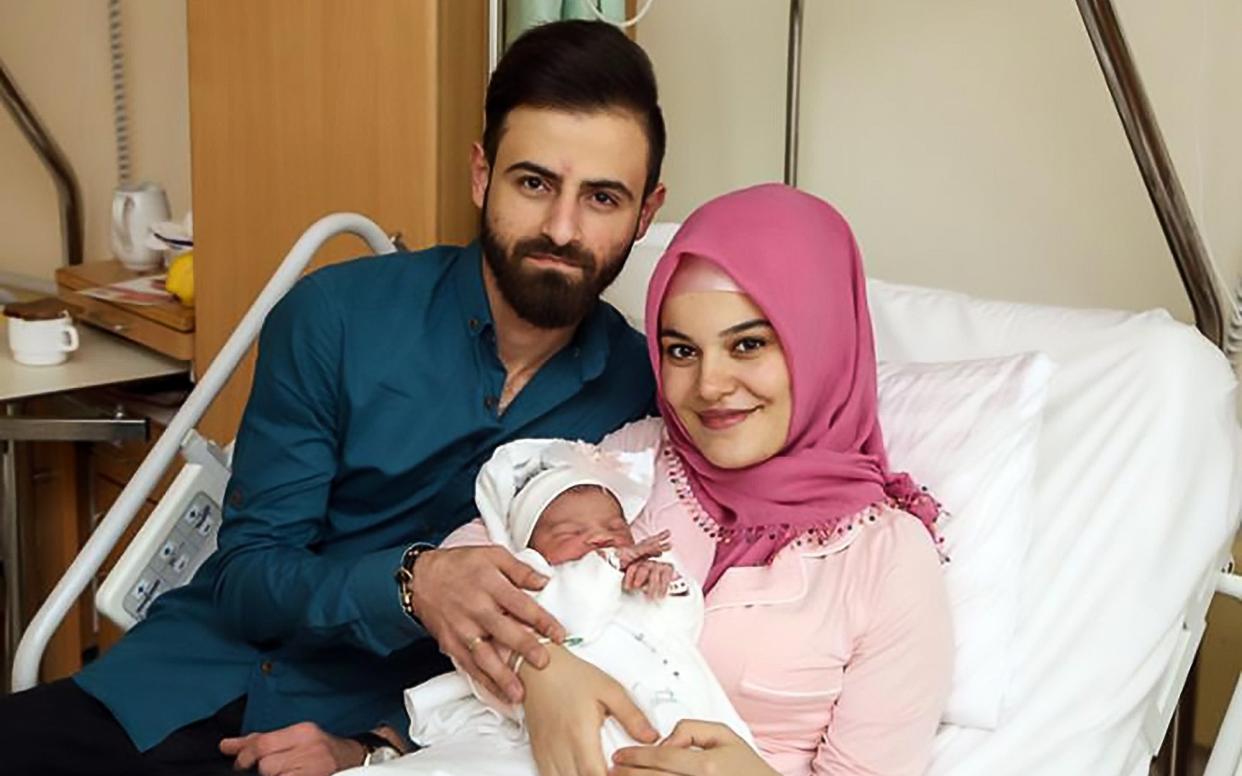 New Year's baby Asel and her parents; Vile racists have flooded the internet with hate speech directed at the official New Year's baby born in Vienna - CEN/KAV/Votava