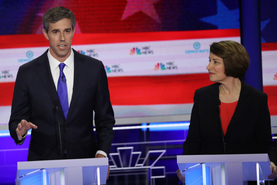 former Texas congressman Beto O'Rourke speaks as Minnesota Sen. Amy Klobuchar looks on during the first night of the Democratic presidential debate on June 26, 2019. | Joe Raedle—Getty Images