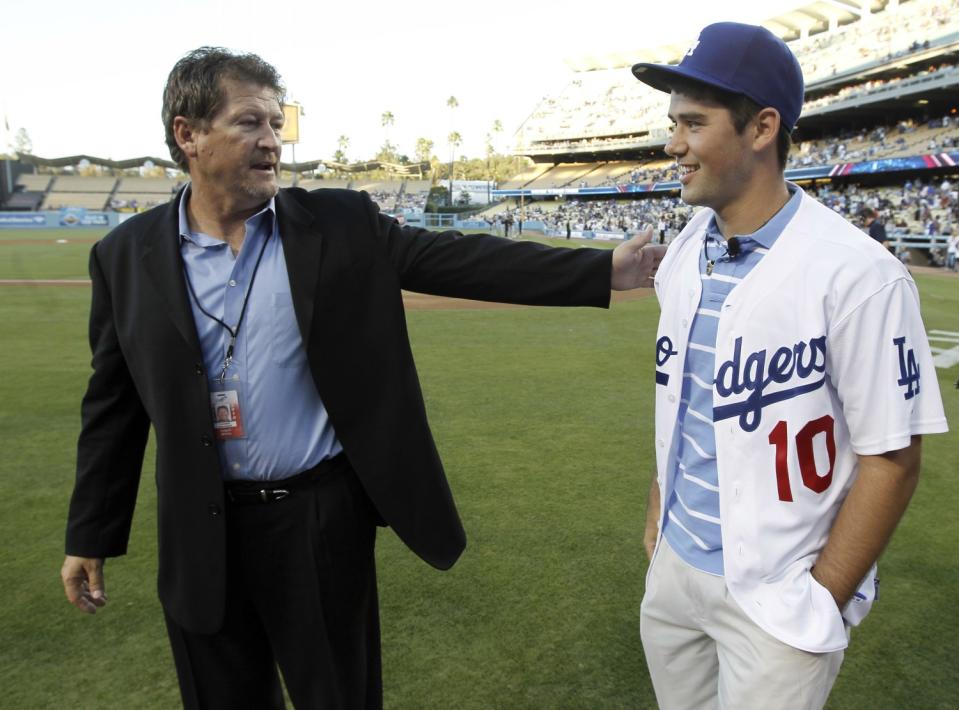 Dodgers assistant general manager Logan White stands with the team's top draft pick, Zach Lee.