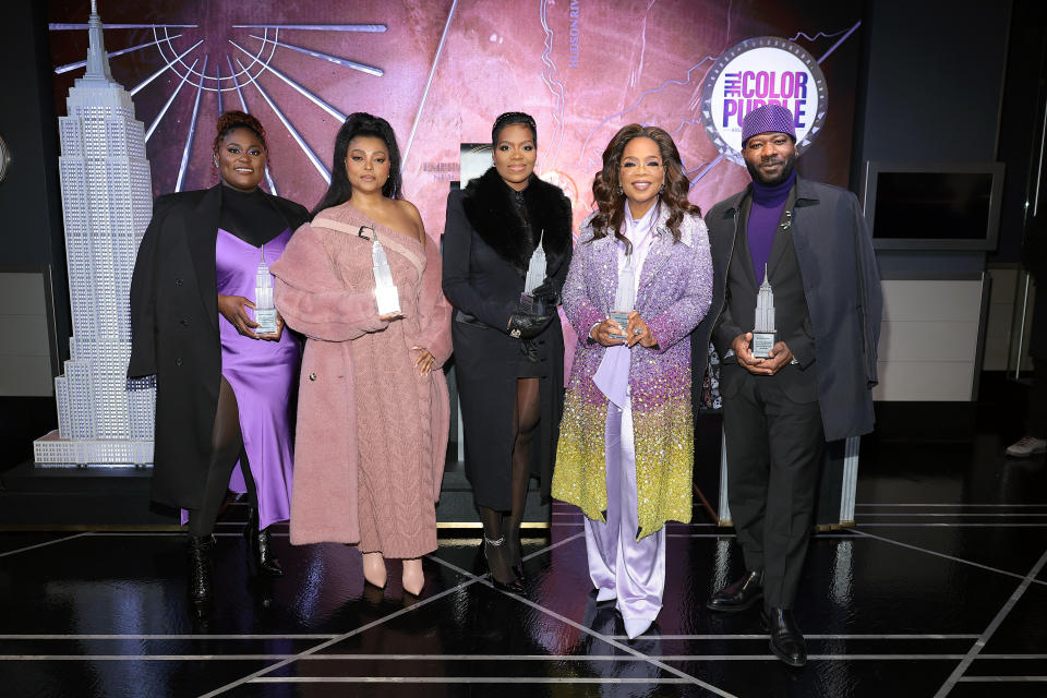 NEW YORK, NEW YORK - DECEMBER 12: (L-R) Danielle Brooks, Taraji P. Henson, Fantasia Barrino, Oprah Winfrey, and Blitz Bazawule attend Oprah and the cast of "The Color Purple" light the Empire State Building in celebration of the film's premiere on December 12, 2023 in New York City. (Photo by Dimitrios Kambouris/Getty Images for Empire State Realty Trust)