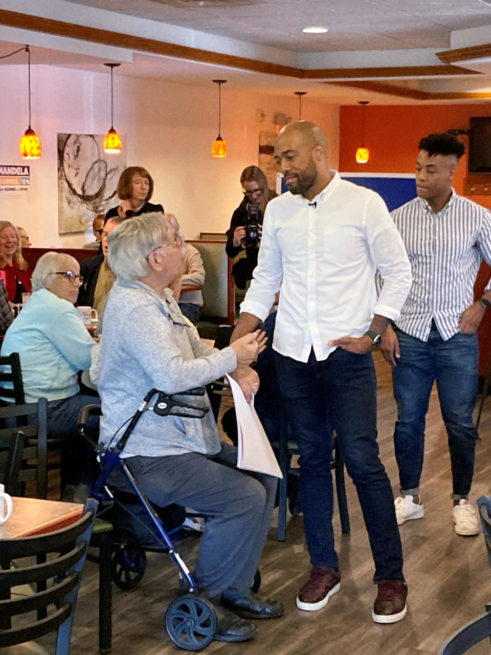 Wisconsin Democratic U.S. Senate candidate Mandela Barnes meets with older voters at Elie’s Café where he repeats his criticisms of Republican Sen. Ron Johnson for questioning guaranteed funding of Social Security and Medicare on Monday, Sept. 26, 2022, in Monona, Wisconsin. (AP Photo/Scott Bauer)