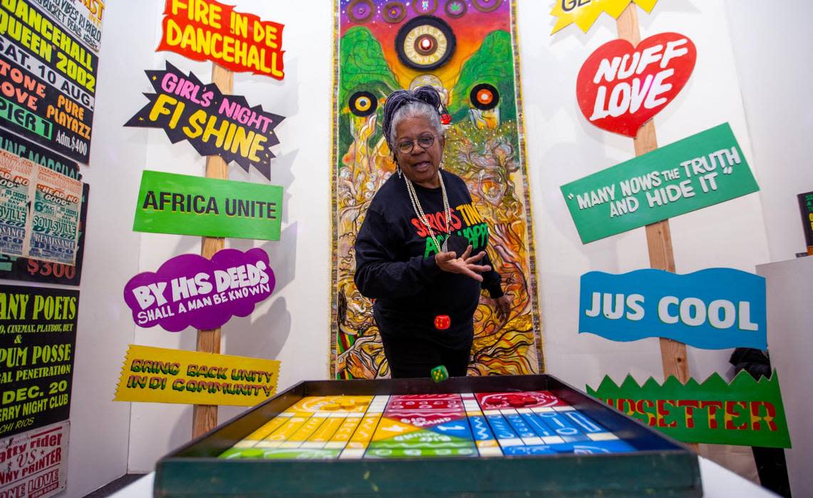 Art conceptualist Maxine Walters throws dice at her installation entitled ‘Serious Tings Ago Happen’ displayed at the Prizm Art Fair.