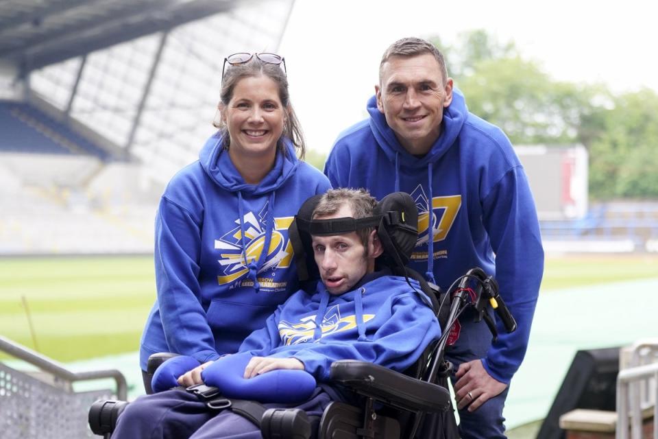 Burrow and his wife Lindsey with Kevin Sinfield (Danny Lawson/PA)