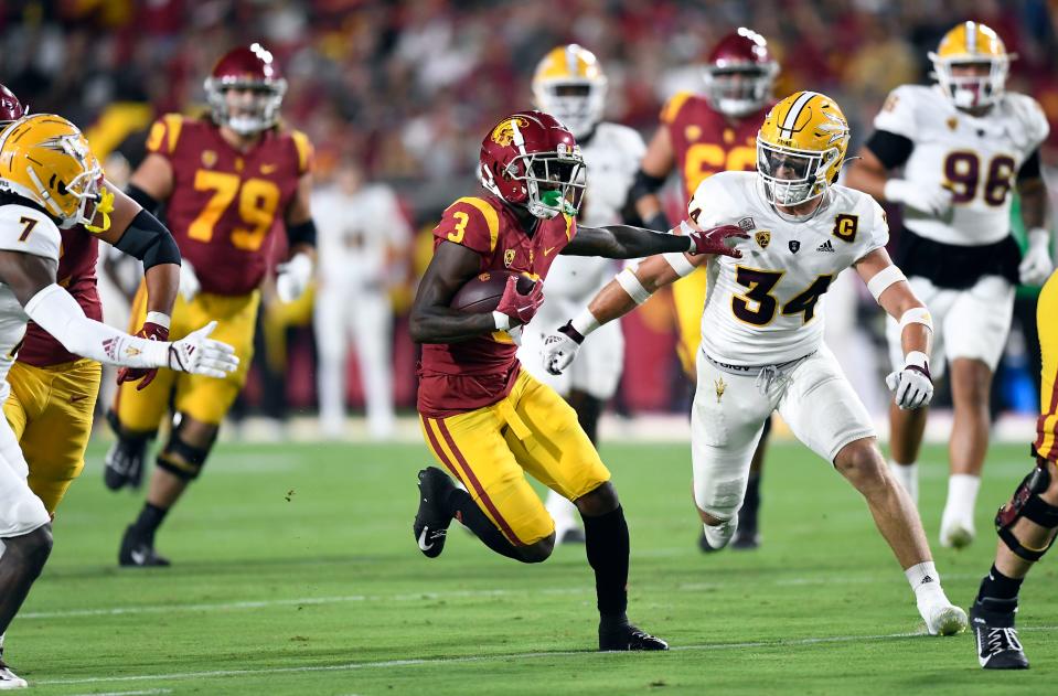 Jordan Addison picks up yards after a catch against Arizona State on Oct. 1, 2022, in Los Angeles.