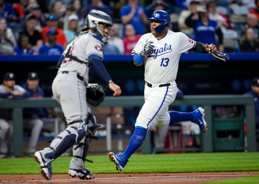 KANSAS CITY, MISSOURI – APRIL 10: Salvador Perez #13 of the Kansas City Royals scores a run against Yainer Diaz #21 of the Houston Astros during the third inning at Kauffman Stadium on April 10, 2024 in Kansas City, Missouri. (Photo by Jay Biggerstaff/Getty Images)