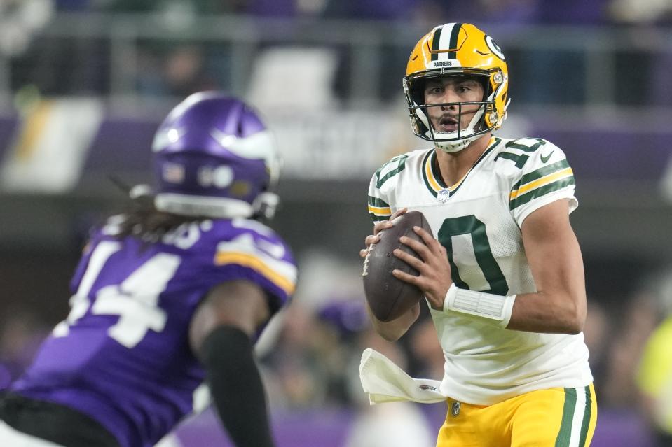 Green Bay Packers' Jordan Love looks to pass during the first half of an NFL football game against the Minnesota Vikings Sunday, Dec. 31, 2023, in Minneapolis. (AP Photo/Abbie Parr)