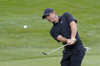 Rory McIlroy, of Northern Ireland, hits to the second green during the third round of the Arnold Palmer Invitational golf tournament Saturday, March 6, 2021, in Orlando, Fla. (AP Photo/John Raoux)