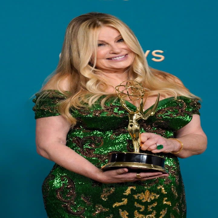 Jennifer Coolidge holding an award