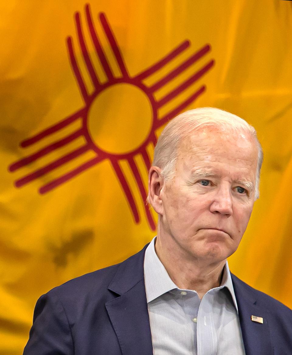 President Joe Biden listens to a briefing by  New Mexico Secretary of Homeland Security and Emergency Management David Dye during a meeting at the New Mexico National Guard Armory on June 11, 2022 to discuss the devastating wildfire season that has stricken the state. Biden said he would support the federal government assuming the full cost of the Hermits Peak/Calf Canyon wildfire, which has devastated a large swath of Northern New Mexico.