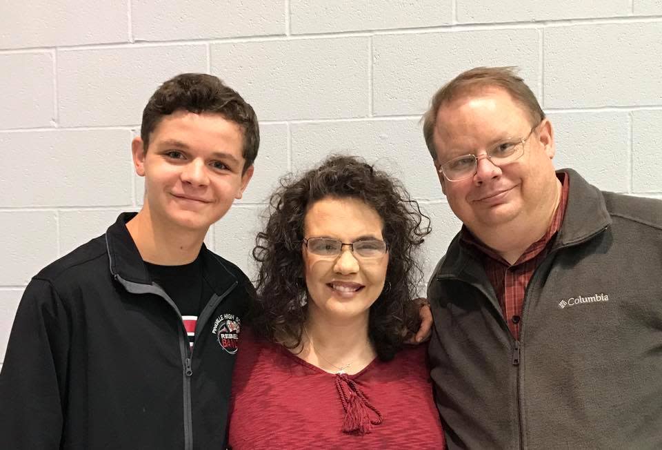 Robert Anderson (right) said being able to arrange a mock graduation ceremony for son Landon Anderson (left) gives his family peace. To see son Landon graduate was the final wish of his wife, Monica Anderson, who died on Feb. 29.