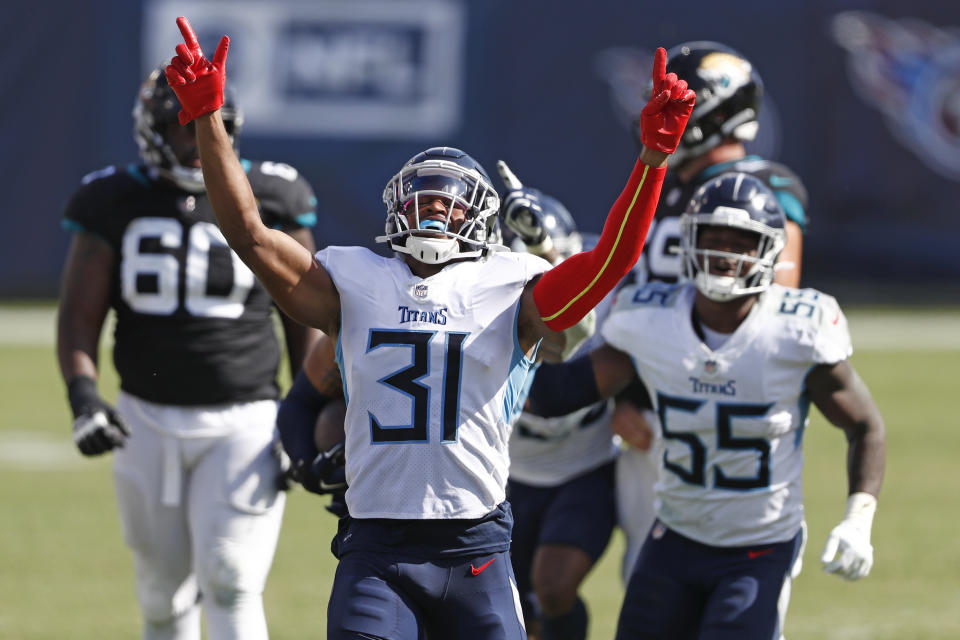 Tennessee Titans free safety Kevin Byard (31) celebrates after teammate Harold Landry intercepted a pass to stop the final drive of the Jacksonville Jaguars in the fourth quarter of an NFL football game Sunday, Sept. 20, 2020, in Nashville, Tenn. The Titans won 33-30.(AP Photo/Wade Payne)