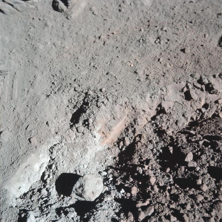 (12 Dec. 1972) — A close-up view of the much-publicized orange soil which the Apollo 17 crewmen found at Station 4 (Shorty Crater) during the second Apollo 17 extravehicular activity (EVA) at the Taurus-Littrow landing site. The orange soil was first spotted by scientist-astronaut Harrison H. Schmitt. (NASA)