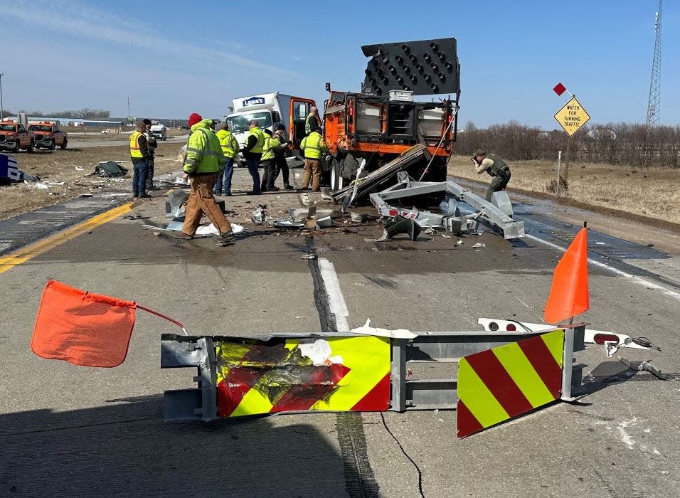 A two-truck crash on Highway 30 Wednesday, March 29, 2023 looks much worse than it was with significant vehicle damage but no serious injuries. A section of an Iowa Department of Transportation truck crash impact attenuator lays crumpled in the foreground.