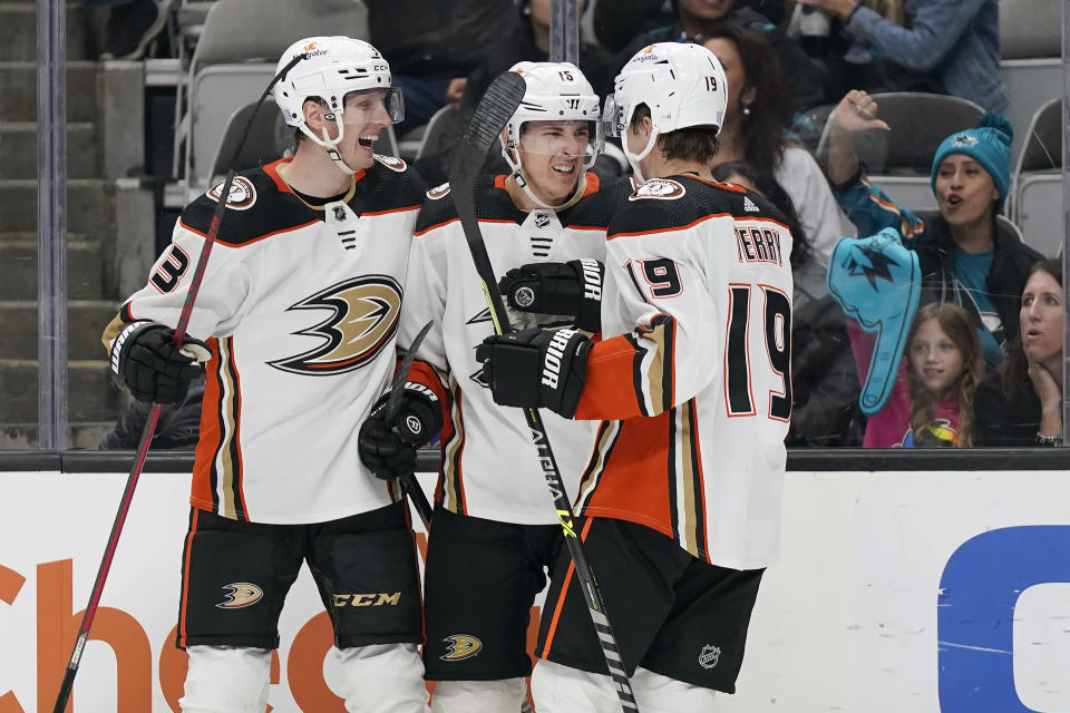 Anaheim Ducks center Ryan Strome, middle, is congratulated by defenseman John Klingberg, left, and right wing Troy Terry (19) after scoring against the San Jose Sharks during the second period of an NHL hockey game in San Jose, Calif., Tuesday, Nov. 1, 2022. (AP Photo/Jeff Chiu)
