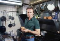 <p>Clint Eastwood eats a sandwich in Pebble Beach, California in 1979.</p>