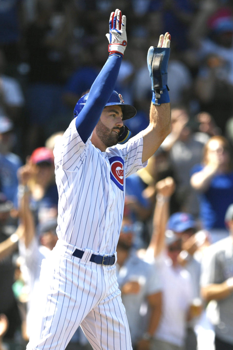 Chicago Cubs' Dansby Swanson (7) celebrates at home plate after scoring on a 3-RBI double hit by teammate Seika Suzuki during the first inning of a baseball game against the San Francisco Giants Wednesday, Sept. 6, 2023, in Chicago. (AP Photo/Paul Beaty)