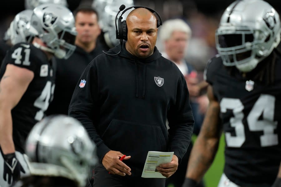 Las Vegas Raiders interim head coach Antonio Pierce walks the sidelines during the first half of an NFL football game against the Minnesota Vikings, Sunday, Dec. 10, 2023, in Las Vegas. (AP Photo/John Locher)