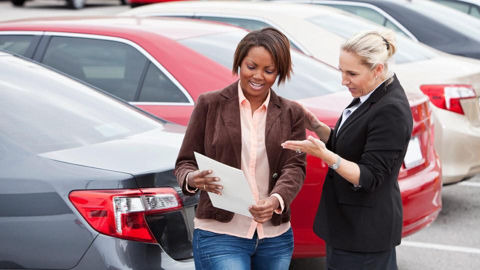 car dealership agent with customer