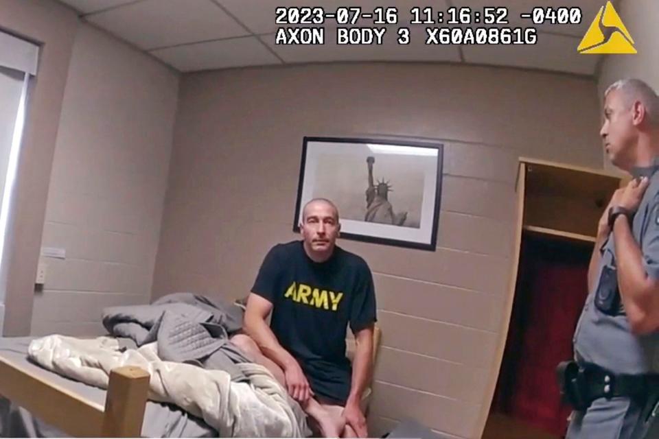 In this image taken from New York State Police body camera video that was obtained by WMTW-TV 8 in Portland, Maine, New York State police interview Army Reservist Robert Card, the man responsible for Maine's deadliest mass shooting, at Camp Smith in Cortlandt, New York on July 16, 2023. Card told state police before being hospitalized that fellow soldiers were worried about him because he was ”gonna friggin' do something,” according to police body cam video released under New York's Freedom of Information Law. Card went on to kill 18 people and wounded 13 at a bowling alley and a bar in Lewiston, Maine, leading to the largest manhunt in state history and tens of thousands of people sheltering in their homes. Card's body was found two days later. He had died by suicide. (WMTW-TV 8/New York State police via AP)