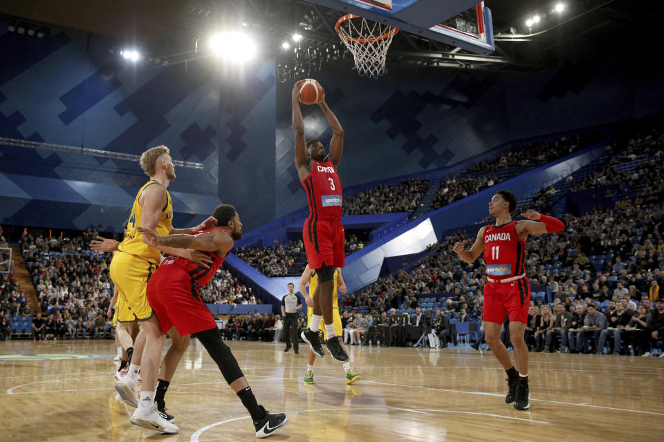 Canada's Melvin Ejim takes a rebound during a pre-World Cup exhibition basketball game against Australia in Perth, Australia, Saturday, Aug. 17, 2019. (Richard Wainwright/AAP Image via AP)