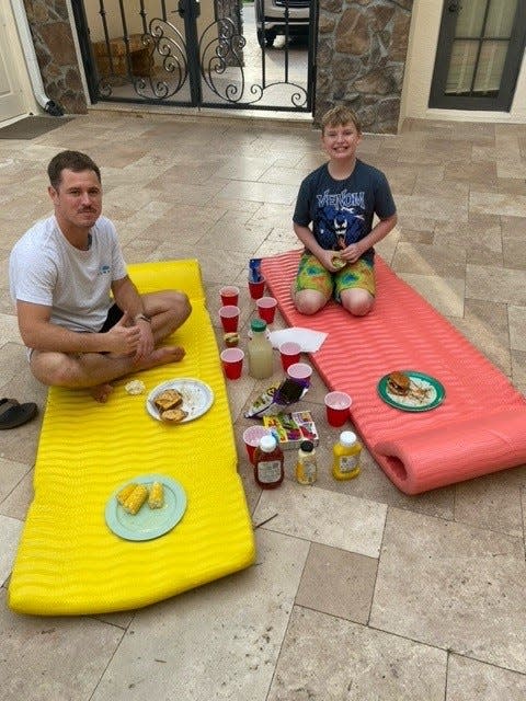 Austen Macmillan and his behavioral therapist Jason Piquette at Austen's home in Wellington, Florida. Austen used CPR to save Piquette after he passed out underwater on Sept. 4, 2023.