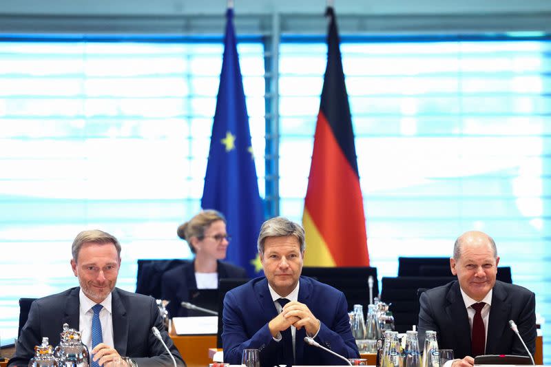 FILE PHOTO: German Chancellor Olaf Scholz, Finance Minister Christian Lindner and Economy Minister Robert Habeck attend a meeting in Berlin