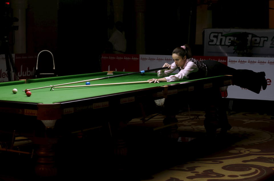 Latvia's Tatjana Vasiljeva plays a shot during her snooker match against India's Amee Kamani during the IBSF World 6 Red Snooker Championships in Karachi, Pakistan, August 8, 2015. REUTERS/Akhtar Soomro