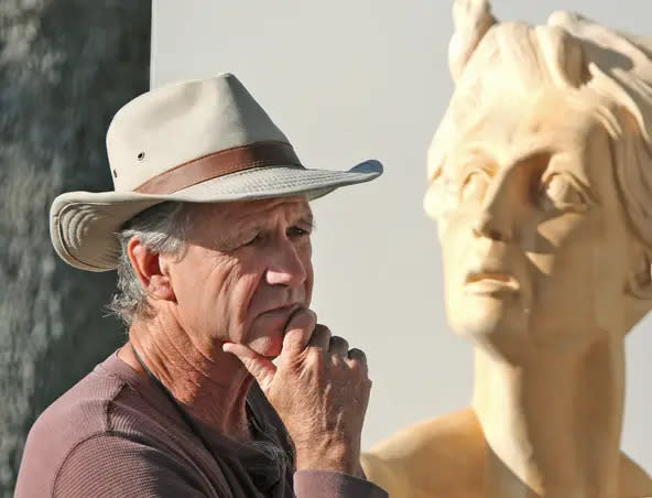 Jack Hill, a DeLand-based sculptor, is pictured here with one of his pieces at the Images Festival of the Arts in New Smyrna Beach in 2017.