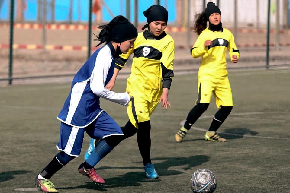 The Under-18 Afghan National Women's Football Team on the pitch in 'Ayenda.'