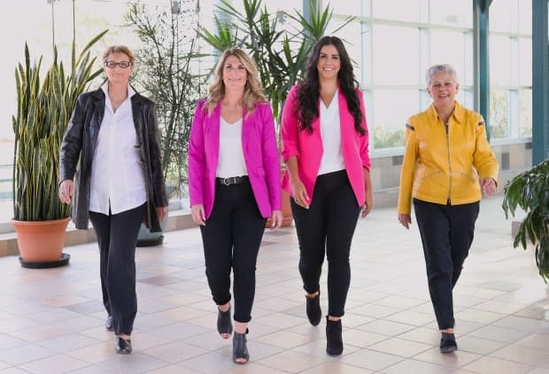 Skylar Gerard, second from left, and Talitha McCloskey, second from right, are the co-founders of RaiseHER Community. Their mothers — Gwen Keith, left, and Marlene Smadu, right — are both active members of the RaiseHER Community. (Kelsey Conway Photography - image credit)