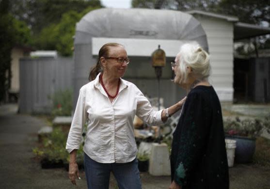 Gayle Cooper (L), 66, chats to Mary Herring, 78, in Village Trailer Park in Santa Monica, July 12, 2012.