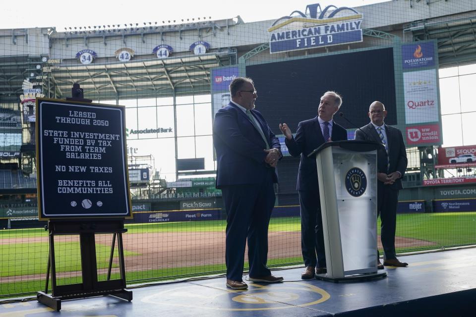 Wisconsin Speaker of the Assembly Robin Vos is flanked by State Rep. Robert Brooks, left, and State Senator Dan Feyen as they unveil a stadium repair funding plan aimed at keeping the Milwaukee Brewers in Milwaukee at a news conference Monday, Sept. 18, 2023, at American Family Field in Milwaukee. The Wisconsin state Senate is poised to approve a plan to spend more than half a billion dollars of public funds to help the Milwaukee Brewers repair their stadium over the next three decades. The Senate is expected to vote on the proposal during a floor session set to begin Tuesday morning, Nov. 14. (AP Photo/Morry Gash, File)