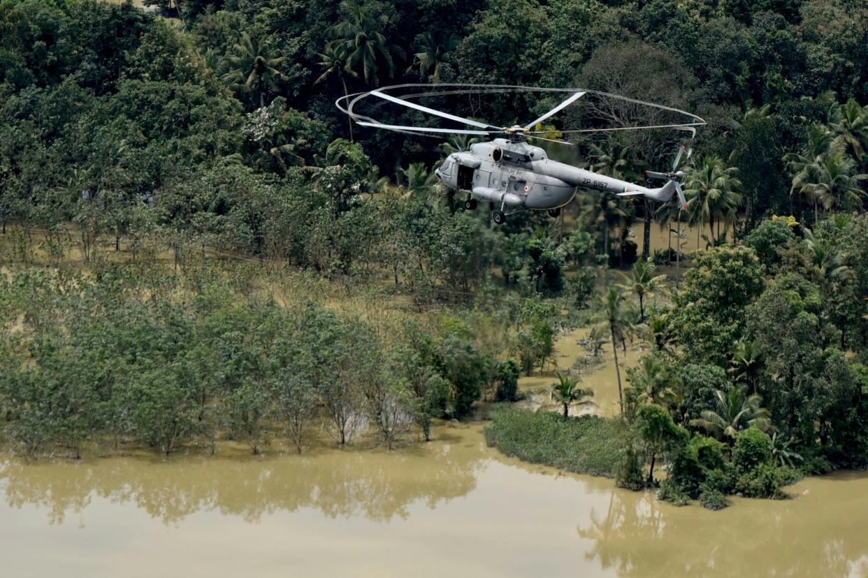 An Indian air-force helicopter on rescue mission flies through Kerala: AP