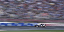 William Byron (24) brings his car through the front stretch during a NASCAR Cup Series auto race at Charlotte Motor Speedway in Concord, N.C., Sunday, May 26, 2019. (AP Photo/Chuck Burton)