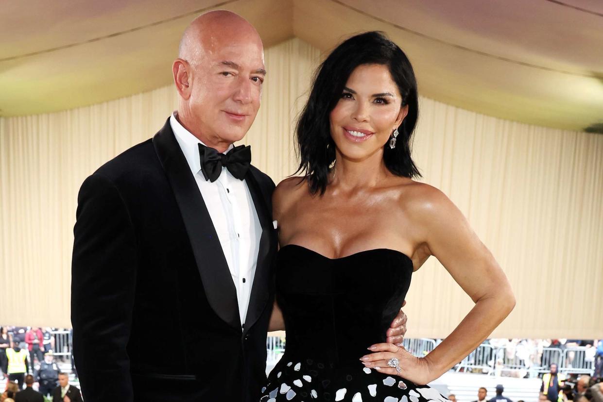 <p>Kevin Mazur/MG24/Getty</p> Jeff Bezos and Lauren Sanchez attend the 2024 Met Gala.