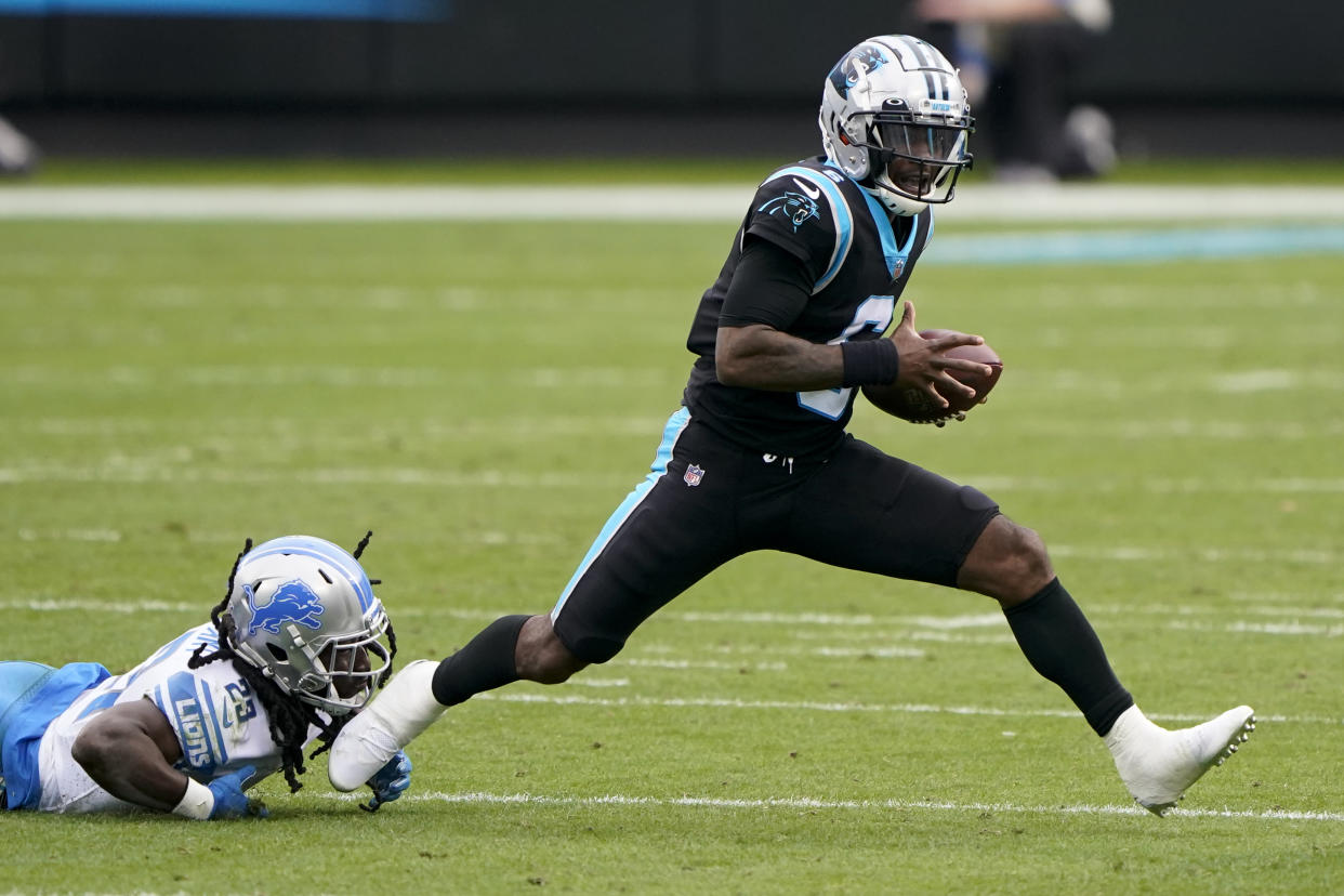 Carolina Panthers quarterback P.J. Walker breaks way from Detroit Lions cornerback Desmond Trufant during the first half of an NFL football game Sunday, Nov. 22, 2020, in Charlotte, N.C. (AP Photo/Brian Blanco)