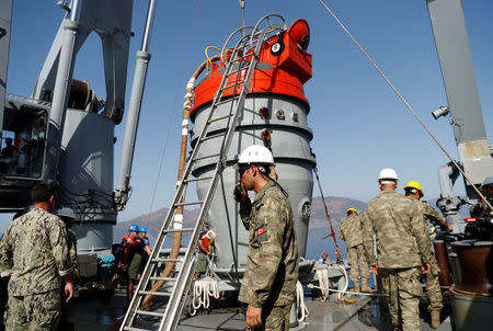 U.S. and Turkish sailors prepare a U.S. Navy Submarine Rescue Chamber to dive on board the Turkish Navy's submarine rescue mother ship TCG Alemdar during the Dynamic Monarch-17, a NATO-sponsored submarine escape and rescue exercise, off the Turkish Naval base of Aksaz, Turkey, September 20, 2017. Picture taken September 20, 2017. REUTERS/Murad Sezer
