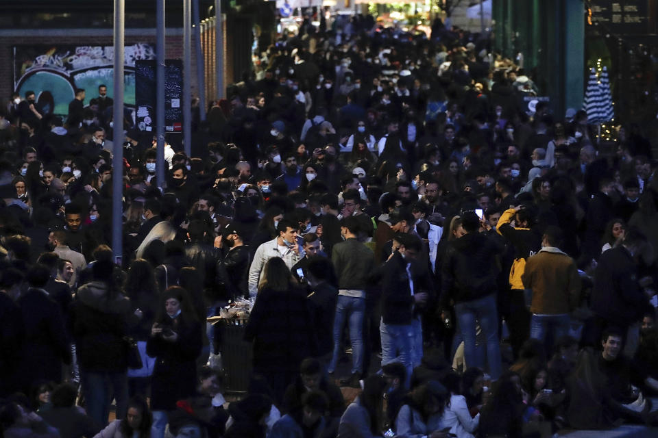 FILE - In this Saturday, Feb. 27, 2021 file photo, people gather at the Darsena dei Navigli, in Milan, Italy. Europe recorded 1 million new COVID-19 cases last week, an increase of 9% from the previous week and ending a six-week decline, WHO said Thursday, March 4, 2021. The so-called UK variant is of greatest concern in the 53 countries monitored by WHO in Europe. (AP Photo/Luca Bruno, File)