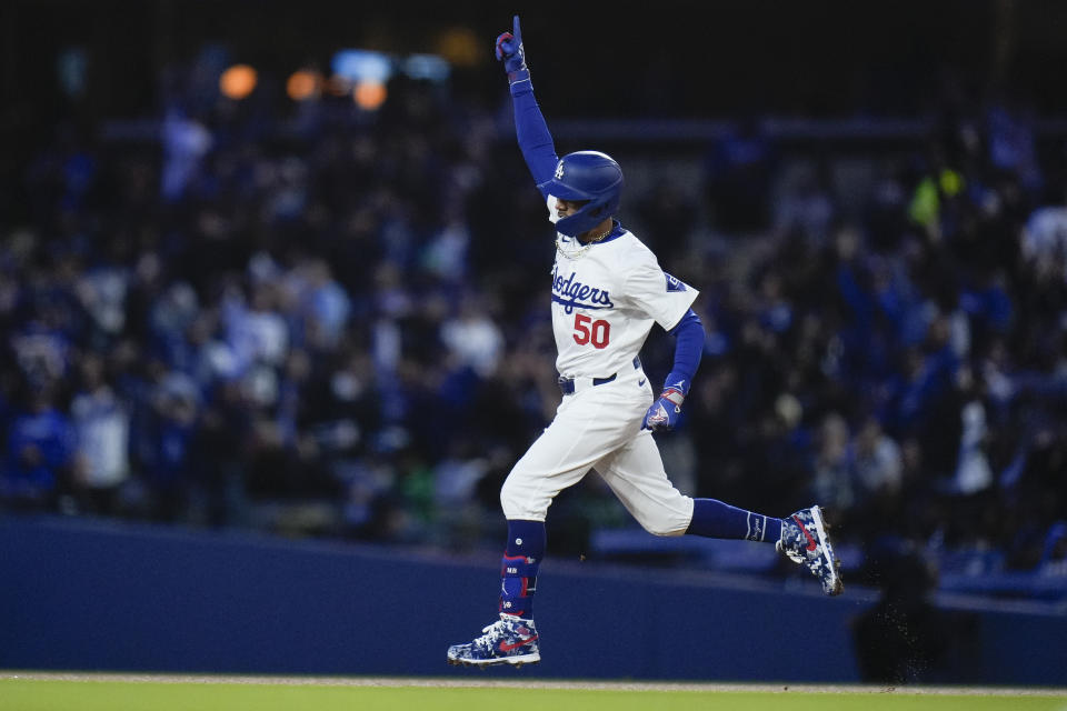 Los Angeles Dodgers' Mookie Betts celebrates his home run during the first inning of a baseball game against the St. Louis Cardinals Friday, March 29, 2024, in Los Angeles. (AP Photo/Jae C. Hong)