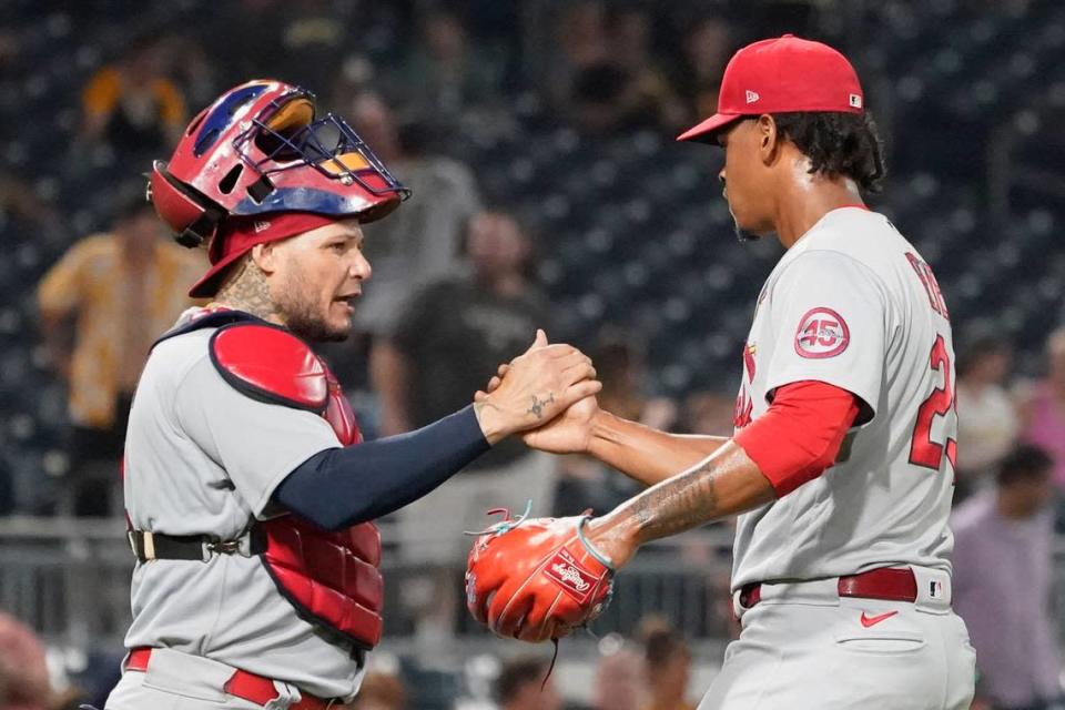 St. Louis Cardinals catcher Yadier Molina congratulates relief pitcher Alex Reyes after the team's 4-3 victory over the Pittsburgh Pirates last season.  On Tuesday, the Cardinals agreed to financial terms with five of their seven arbitration-eligible players, including Reyes and fellow reliever Giovanny Gallegos.
