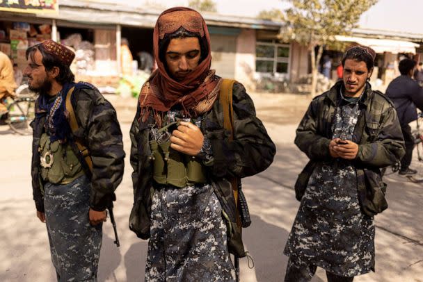 PHOTO: Taliban member Shafiullah, 19, (C), from Maidan Wardak Province, stands at a checkpoint in Kabul, Afghanistan, Oct. 22, 2021.  (Jorge Silva/Reuters)