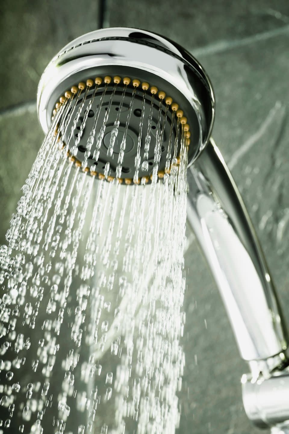 Clean a showerhead with a plastic bag.