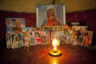 <p>Tamara, who keeps a collection of saints in the corner of her room with a lighted candle, often talks about how she will not live past 30. (Photo: Danielle Villasana) </p>